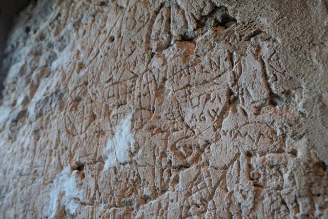 Engravings on the walls of the town hall tower in Strzelin 